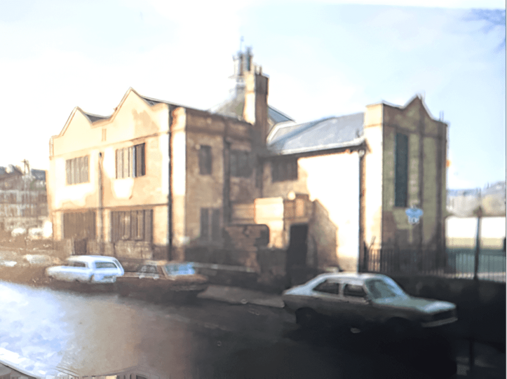 A blurry picture of cars parked in front of an old building.